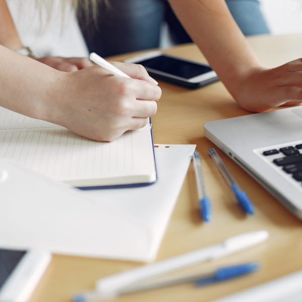 Students create a new project. Two girls working at the office
